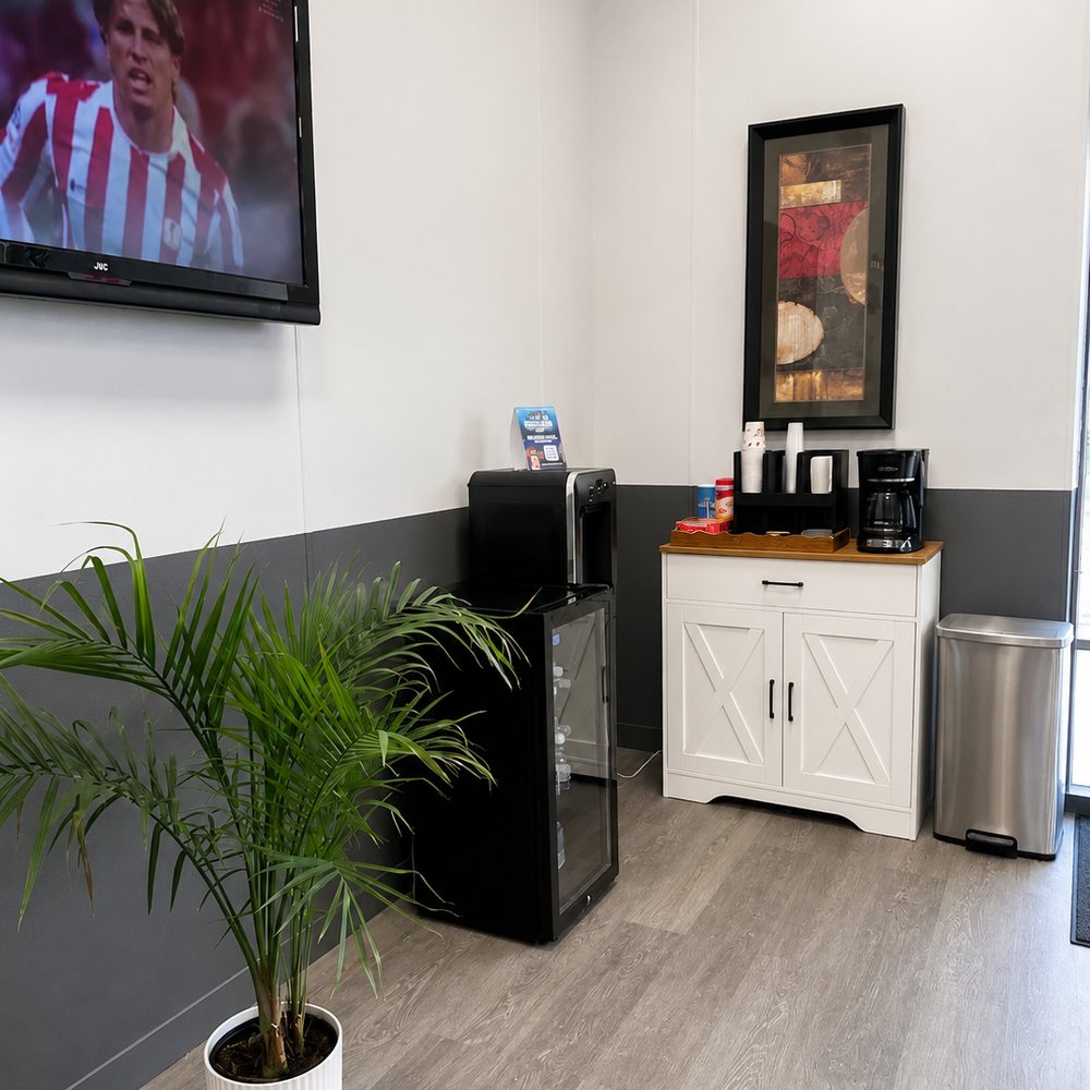 Complimentary coffee, bottled water and TV in the Ogden Auto Service waiting area